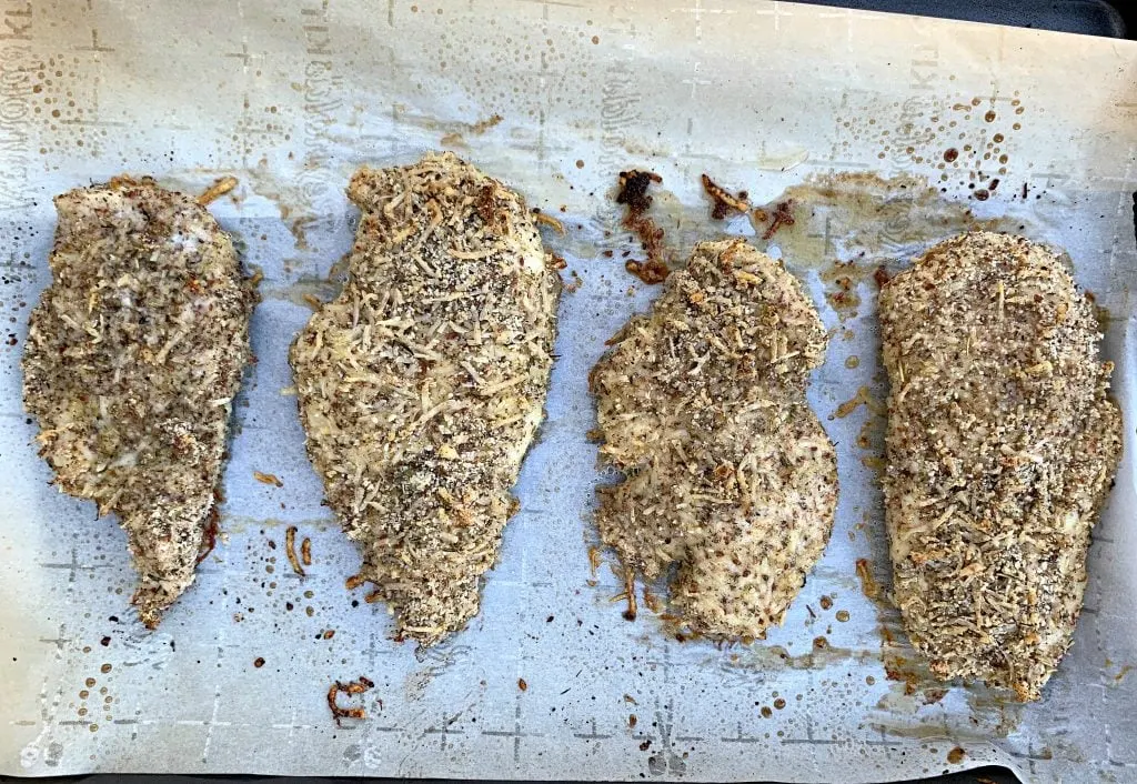 keto parmesan chicken on parchment paper