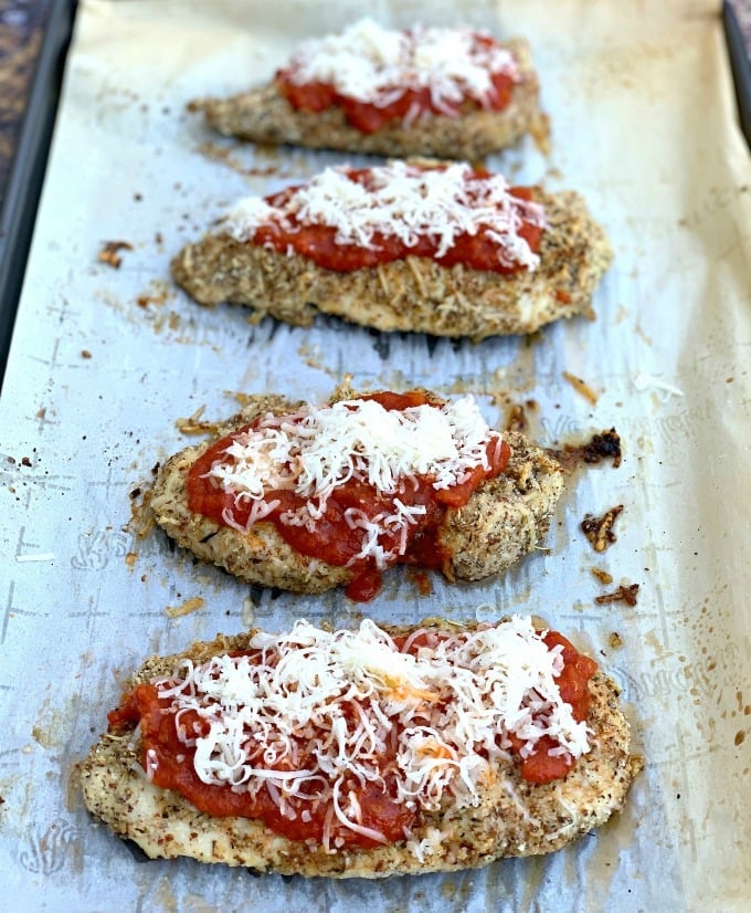 keto parmesan chicken on parchment paper