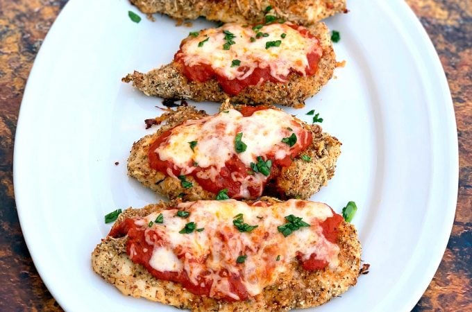keto parmesan chicken on a white plate