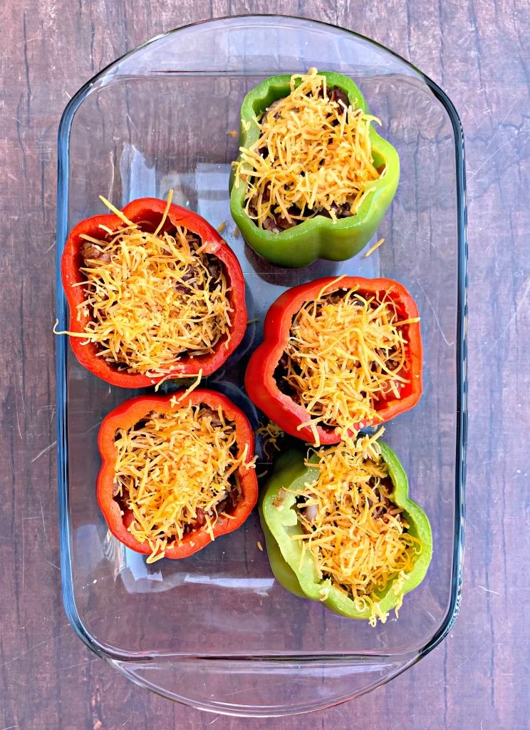 keto low carb bacon stuffed peppers in a glass pan
