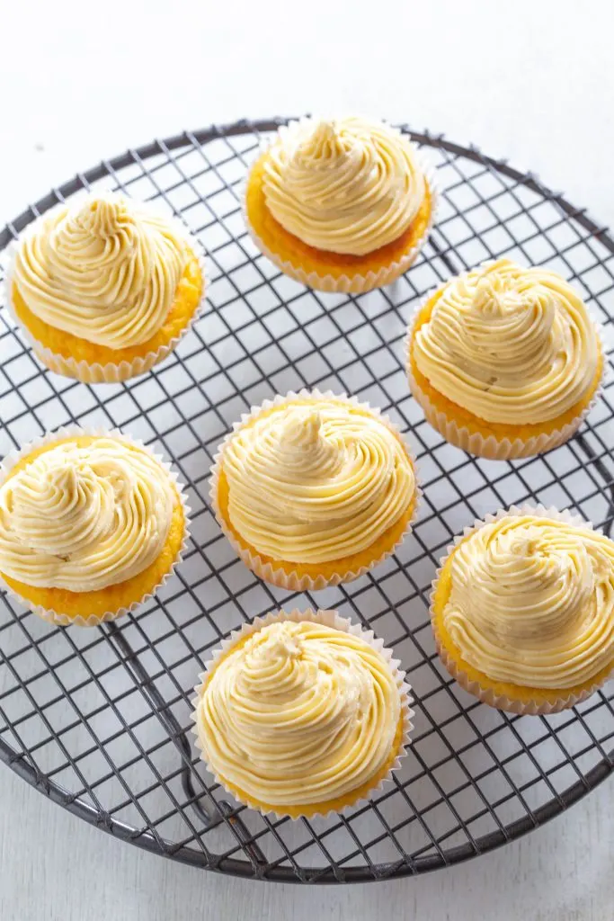 keto vanilla buttercream cupcakes on a white plate