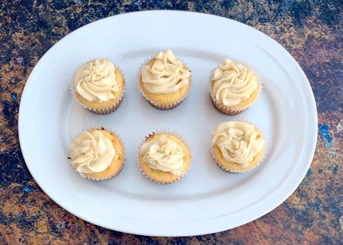 keto vanilla buttercream cupcakes on a white plate