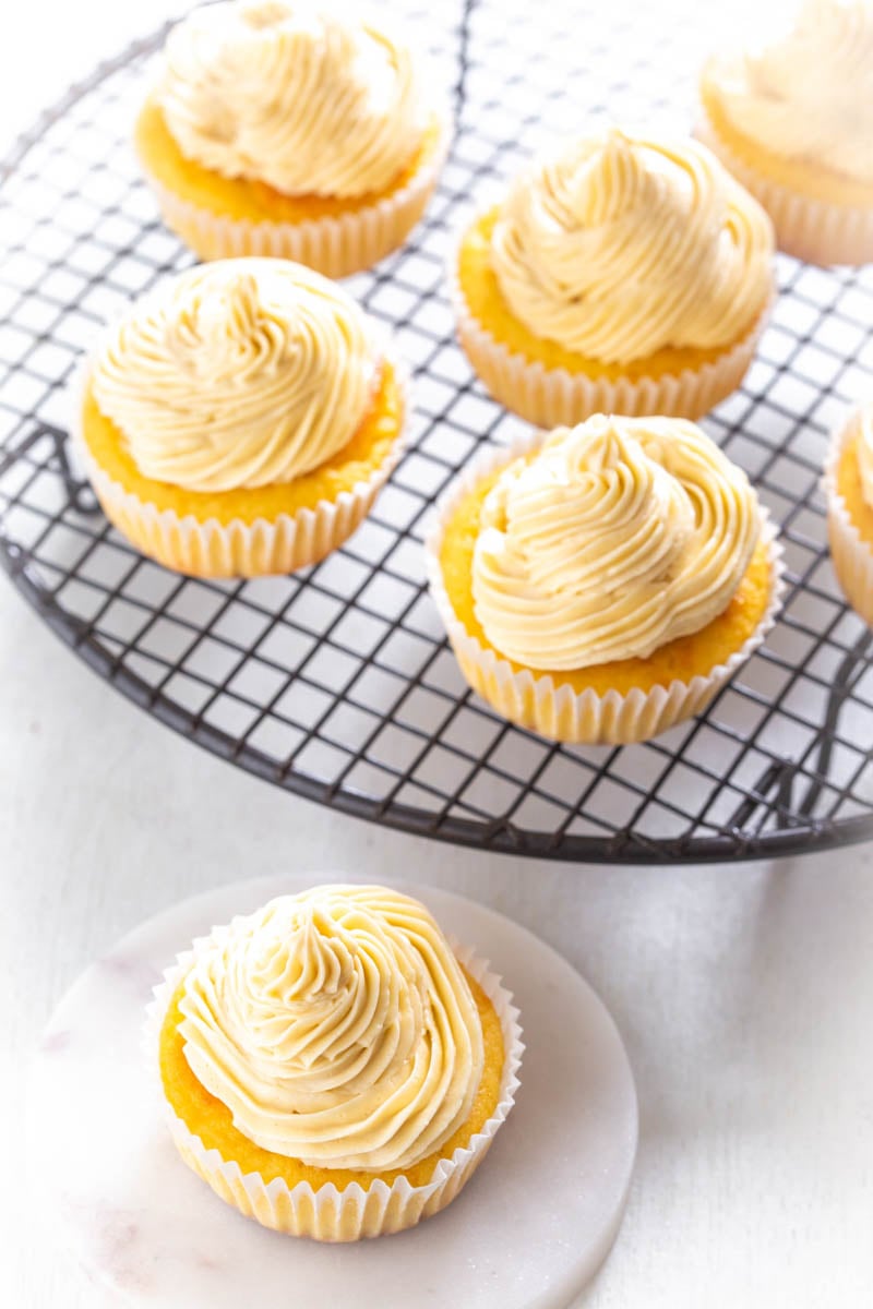 keto vanilla buttercream cupcakes on a white plate