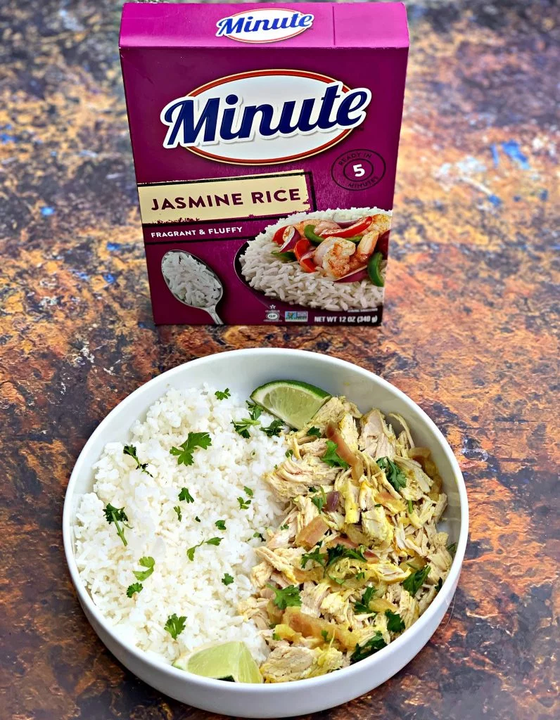 curry chicken and jasmine rice in a white bowl