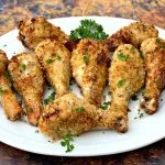 air fryer chicken drumsticks on a white plate