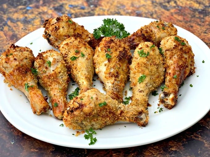 air fryer chicken drumsticks on a white plate