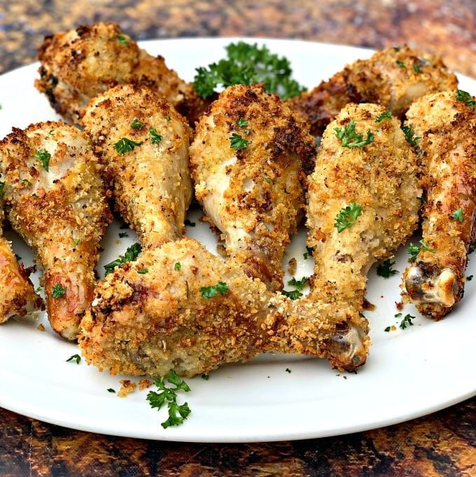 air fryer chicken drumsticks on a white plate