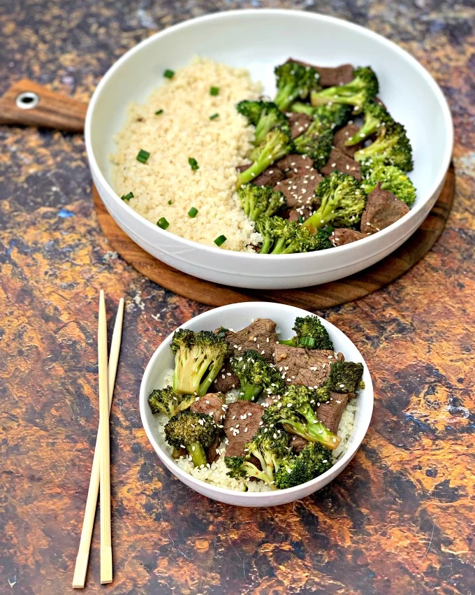 keto beef and broccoli in a white bowl with chopsticks
