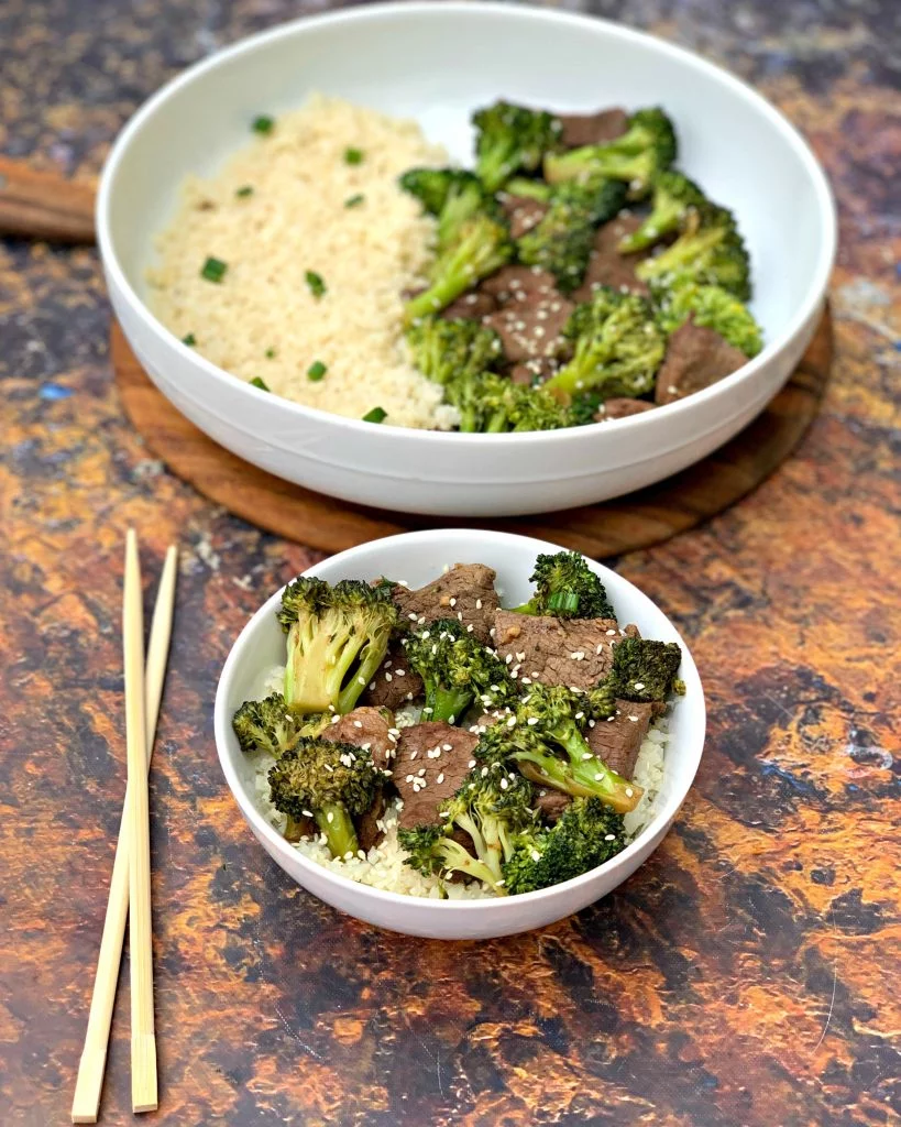 keto beef and broccoli with cauliflower rice in a white bowl