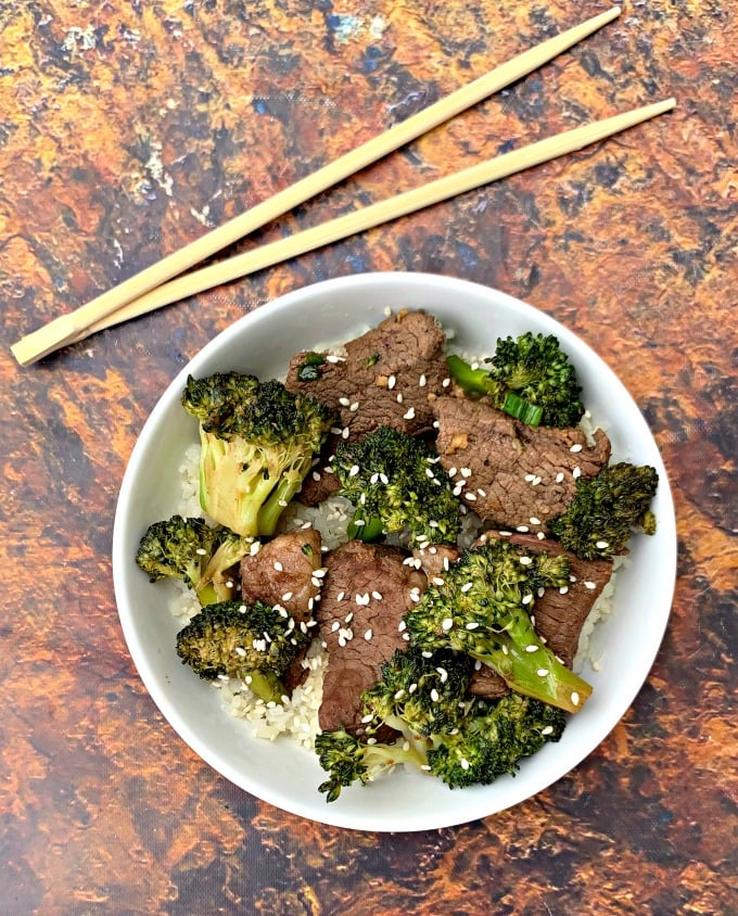 keto beef and broccoli with cauliflower rice in a white bowl