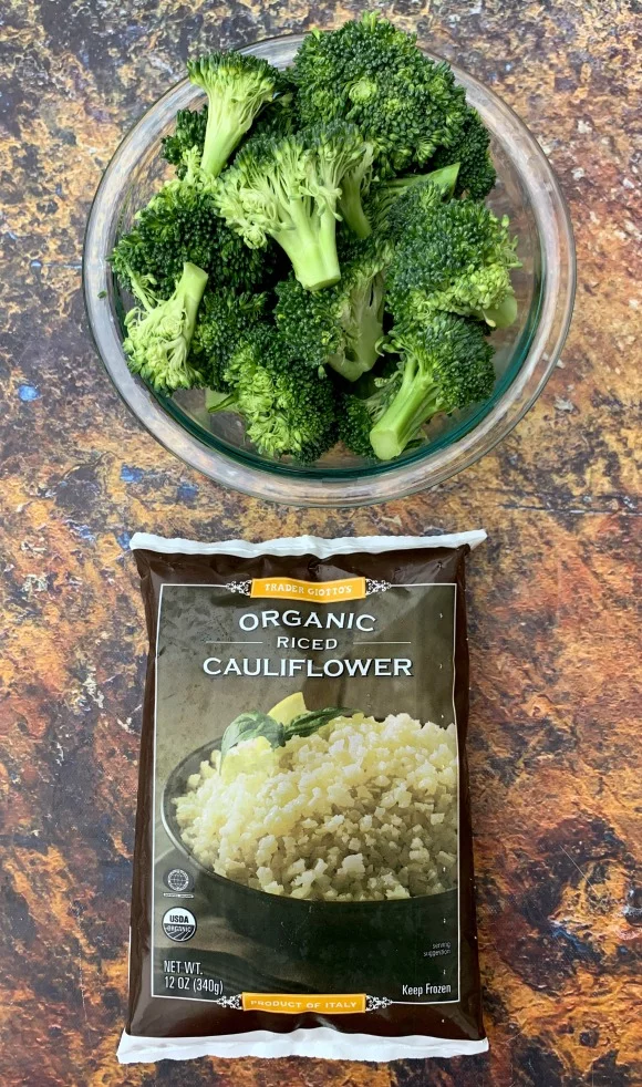fresh broccoli in a bowl and a bag of frozen riced cauliflower