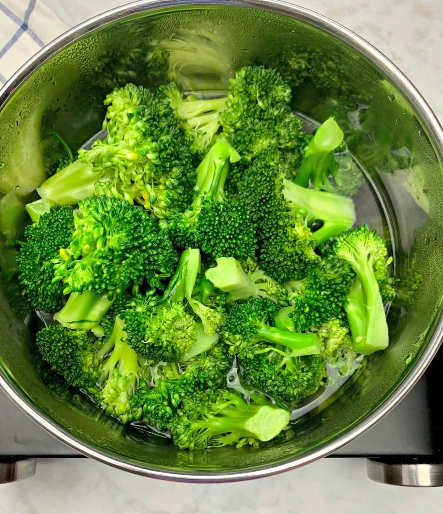 steamed broccoli with water in a saucepan
