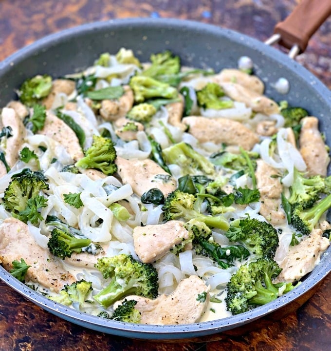 keto chicken alfredo with broccoli and spinach in a skillet