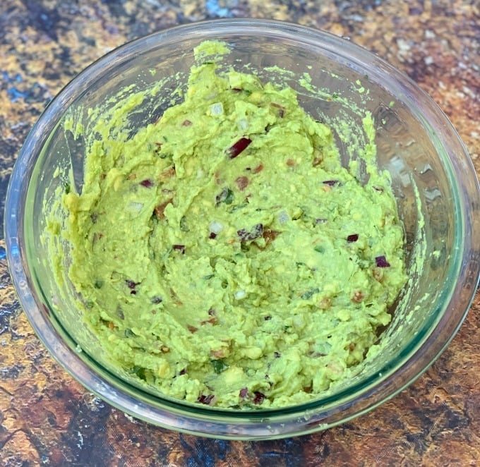 keto low carb guacamole in a glass bowl