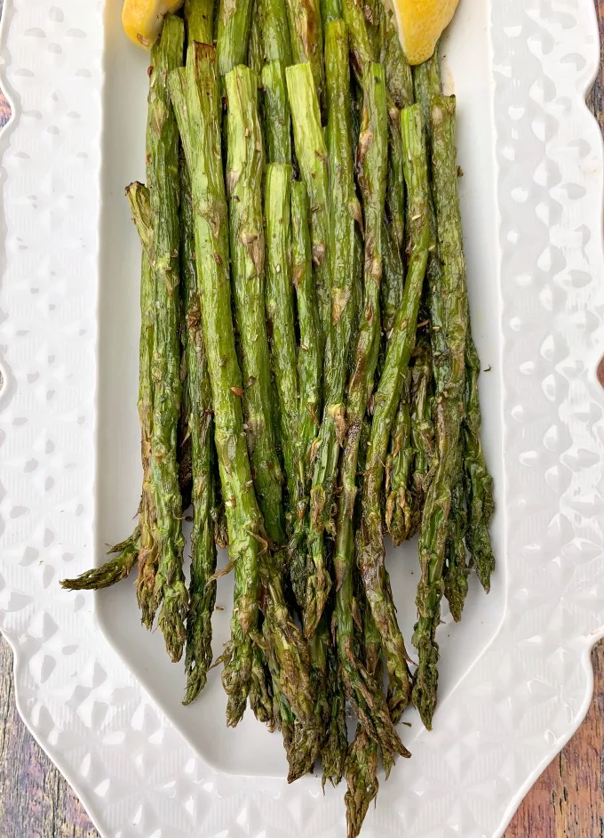 air fryer roasted asparagus on a white plate