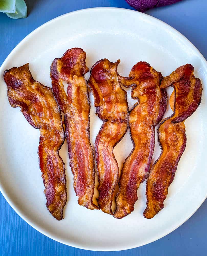 cooked air fryer bacon on a white plate