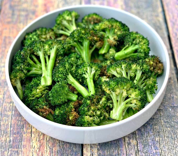 roasted air fryer broccoli in a white bowl