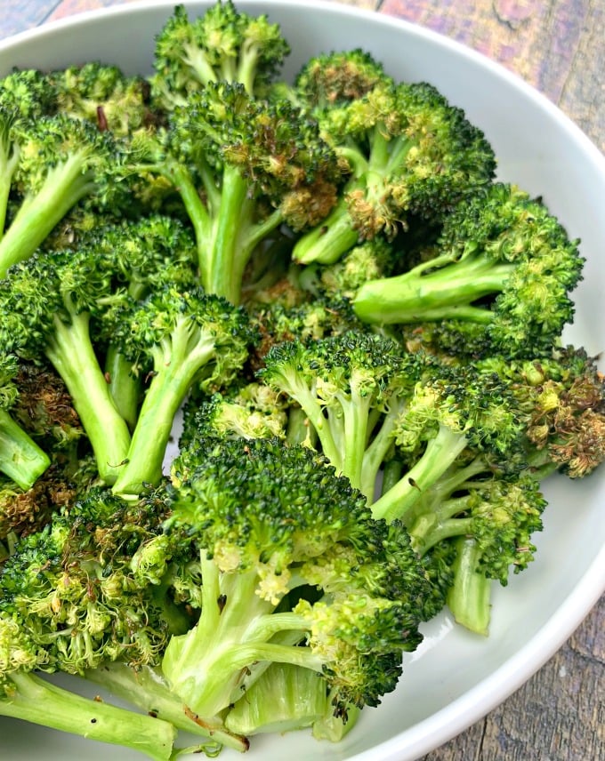 roasted air fryer broccoli in a white bowl