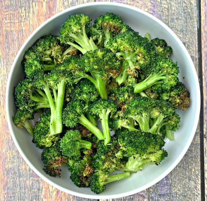 roasted air fryer broccoli in a white bowl