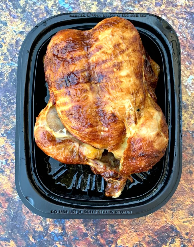 cooked rotisserie chicken in packaging