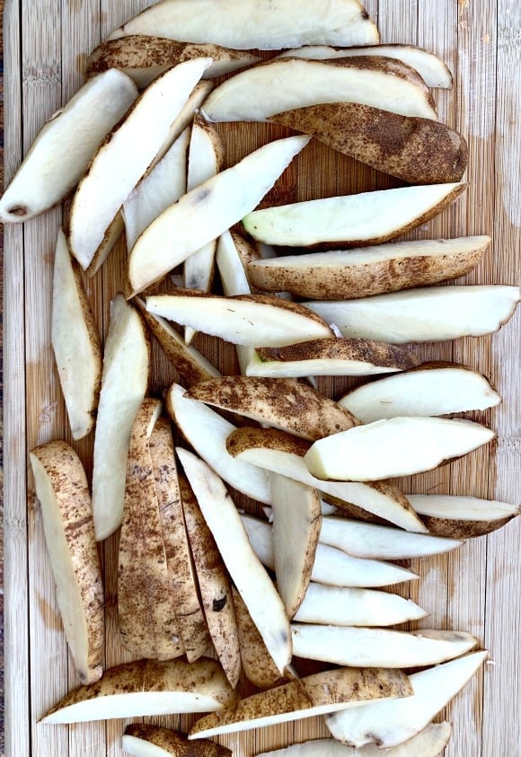 sliced potatoes on a cutting board