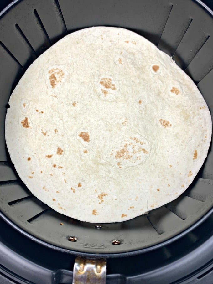 air fryer chicken quesadillas inside an air fryer