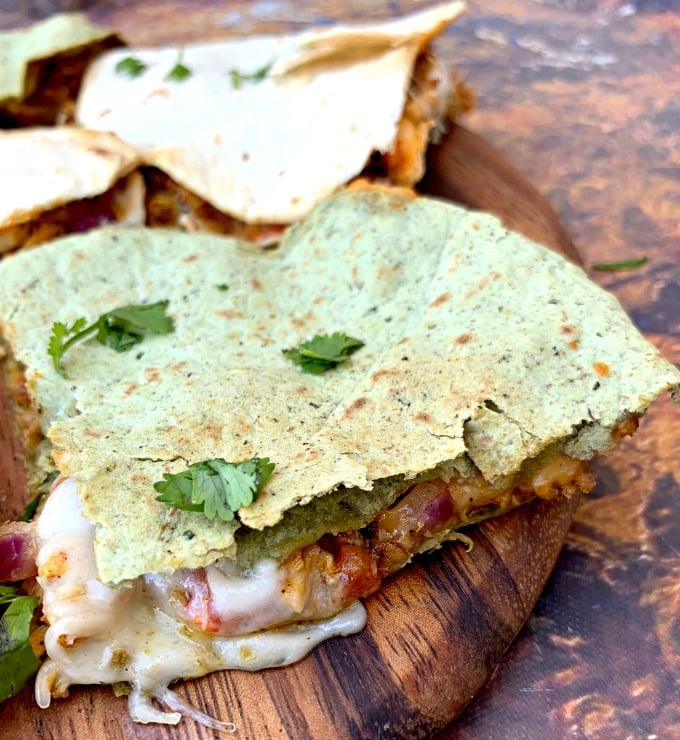 air fryer chicken quesadillas on a brown board