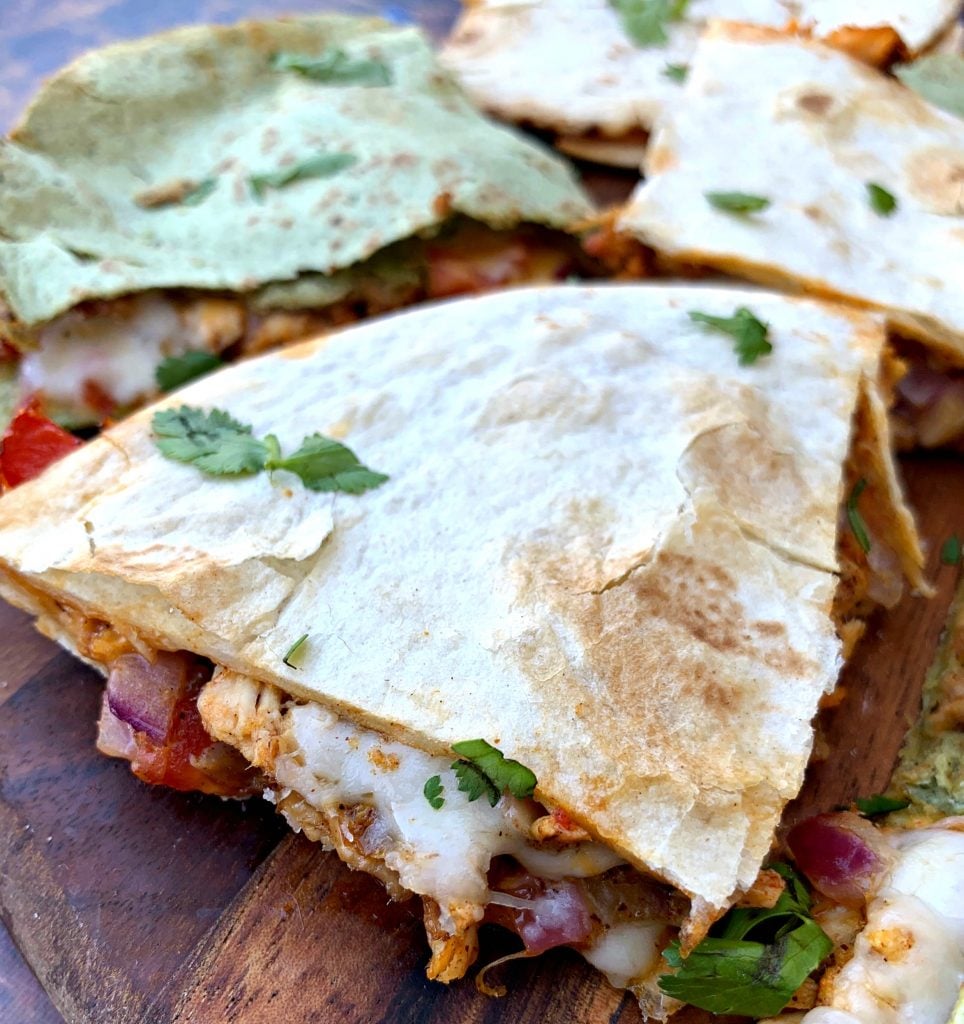 air fryer chicken quesadillas on a brown board