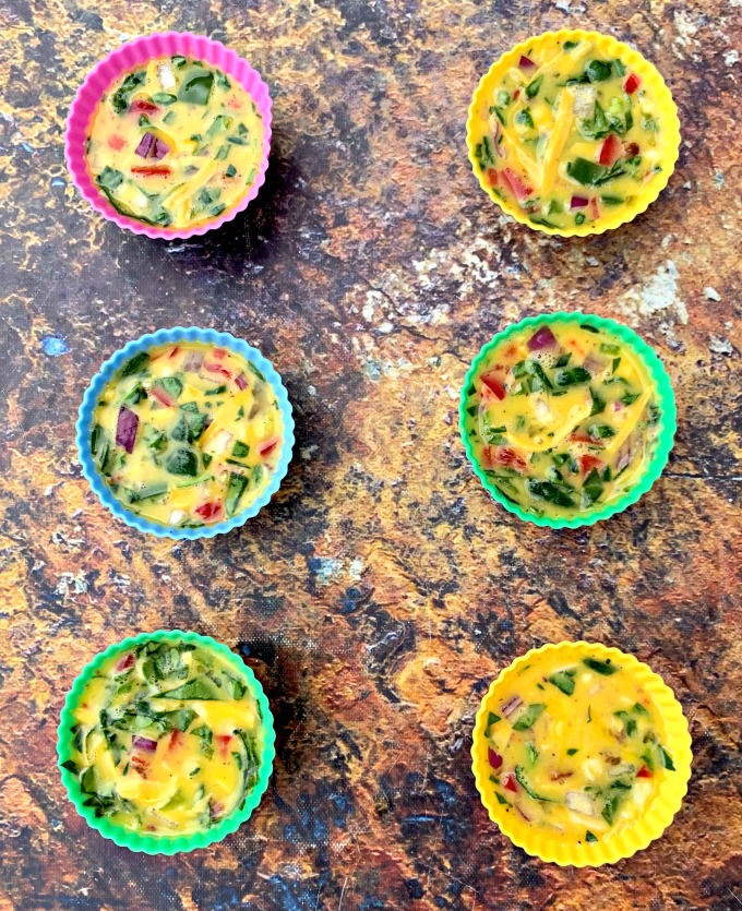 raw keto low carb air fryer egg bites cups on a flat surface