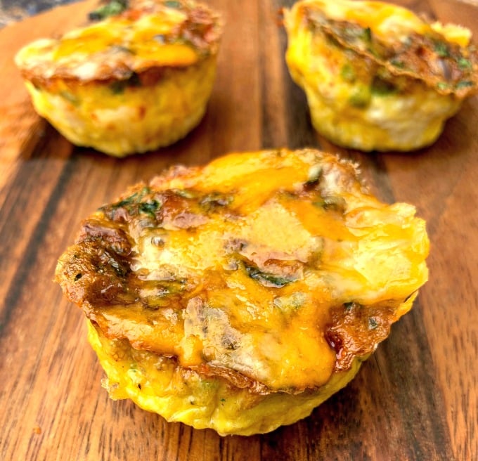 keto low carb air fryer egg bites cups on a brown plate