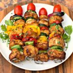 air fryer grilled chicken kebobs on a white plate