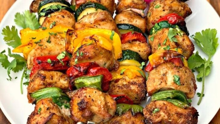 air fryer grilled chicken kebobs on a white plate