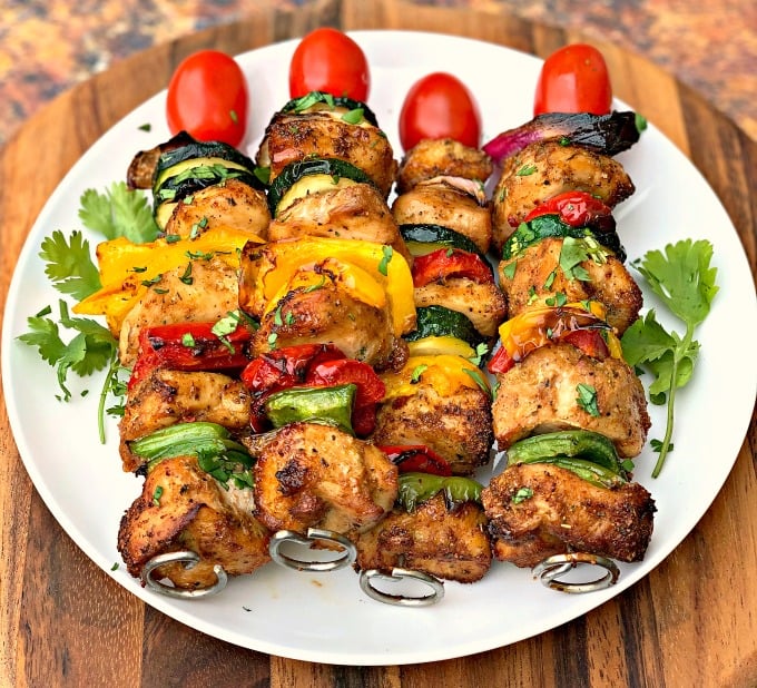 air fryer grilled chicken kebobs on a white plate