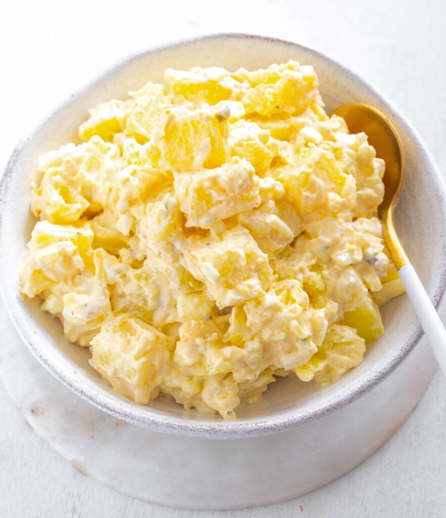 Instant Pot potato salad in a white bowl