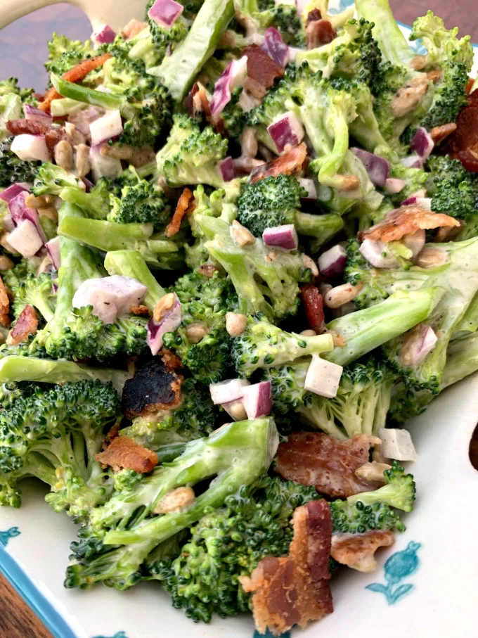chopped broccoli with mayo, red onions, sunflower seeds, bacon, and sweetener