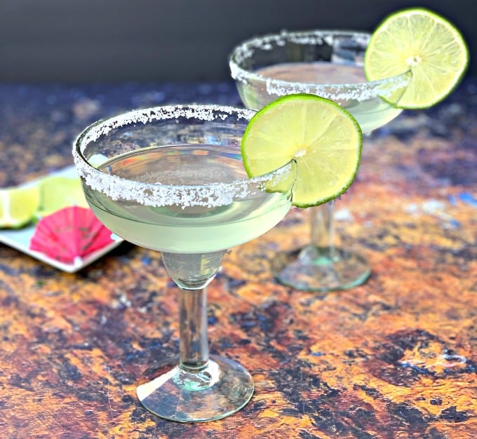 2 keto low carb skinny margaritas in glasses garnished with lime