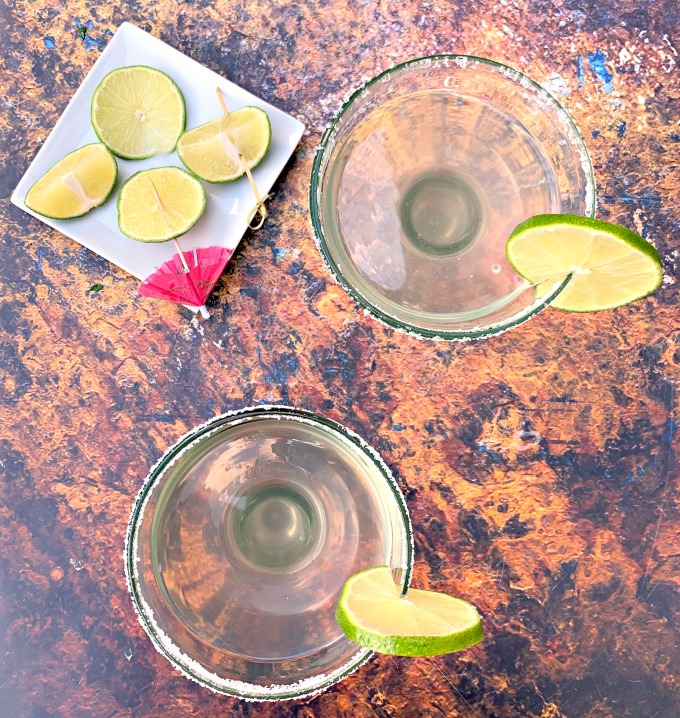 2 keto low carb skinny margaritas in glasses garnished with lime