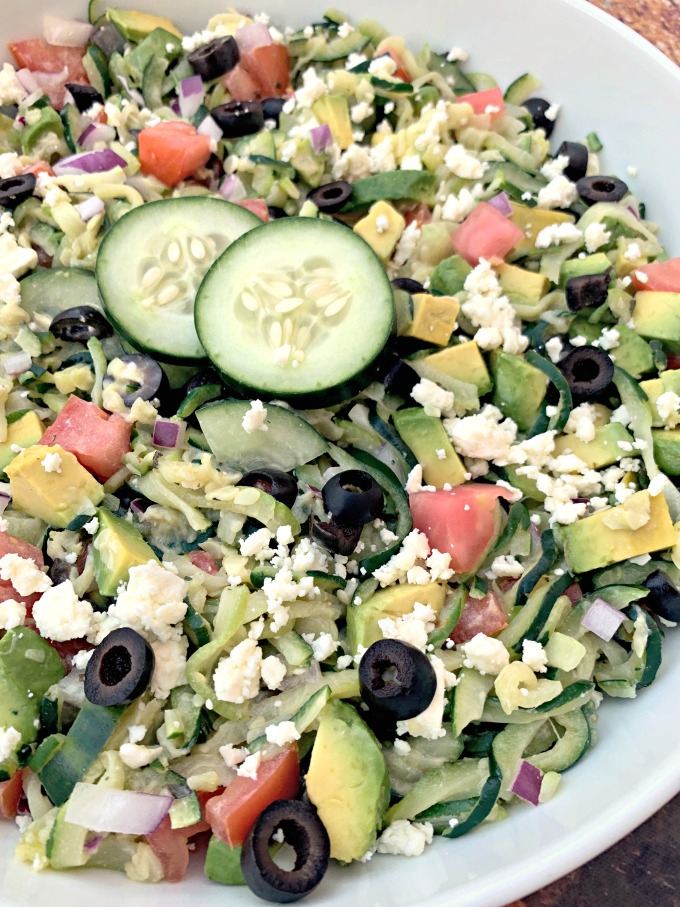 keto zucchini noodles pasta salad with tomatoes, olives, cucumbers, feta cheese, and red onions