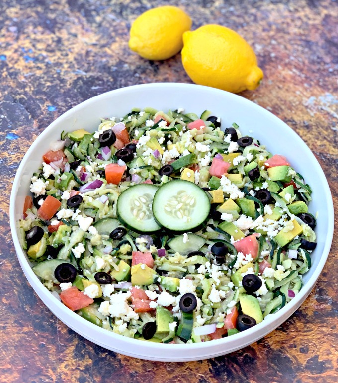 keto zucchini noodles pasta salad with tomatoes, olives, cucumbers, feta cheese, and red onions