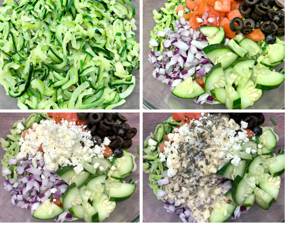 zucchini noodles in a glass bowl with tomatoes, olives, cucumbers, feta cheese, and red onions