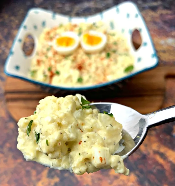 keto cauliflower potato salad on a spoon