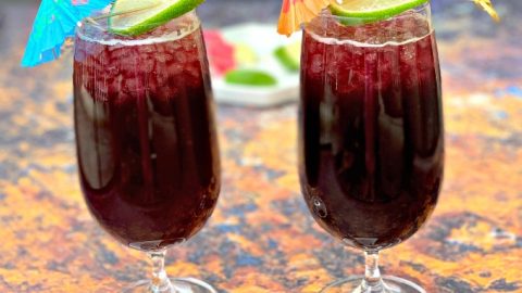 2 glasses of keto low carb red wine sangria with a lime