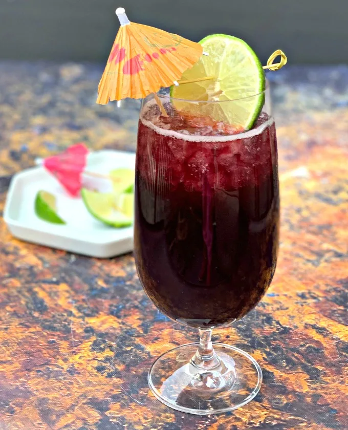 keto low carb red wine sangria in a wine glass with a lime