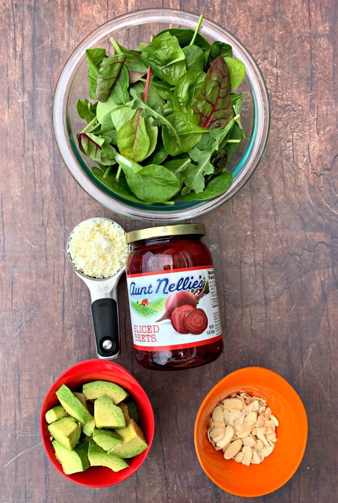 fresh mixed greens, feta cheese, sliced avocado, and almonds