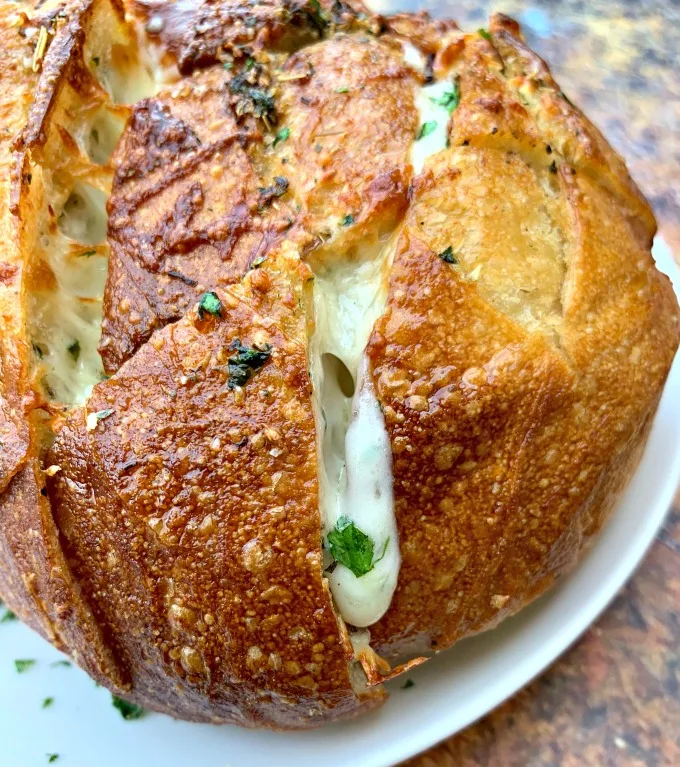 air fryer pull apart garlic cheese bread on a white plate