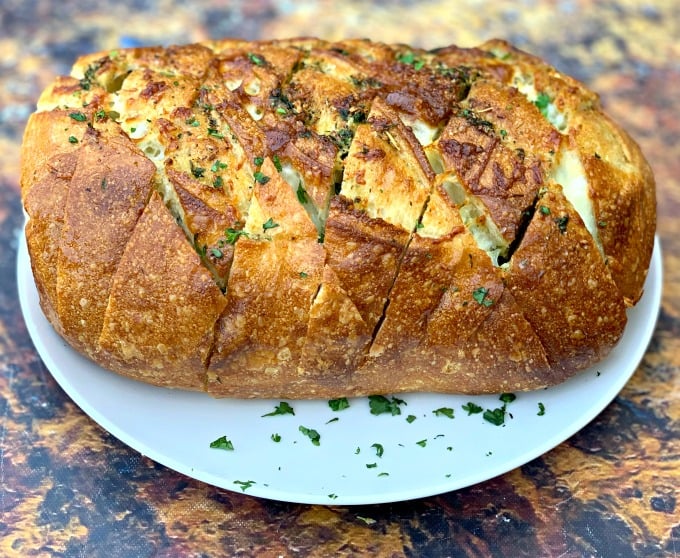 air fryer pull apart garlic cheese bread on a white plate