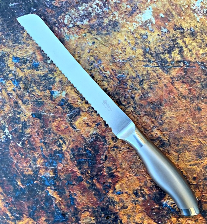 serrated bread knife on a flat surface