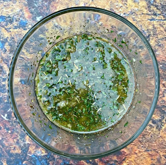 butter, olive oil, parsley and garlic in a bowl for air fryer garlic bread