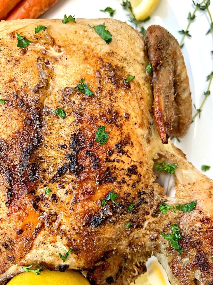 air fryer whole chicken on a white plate