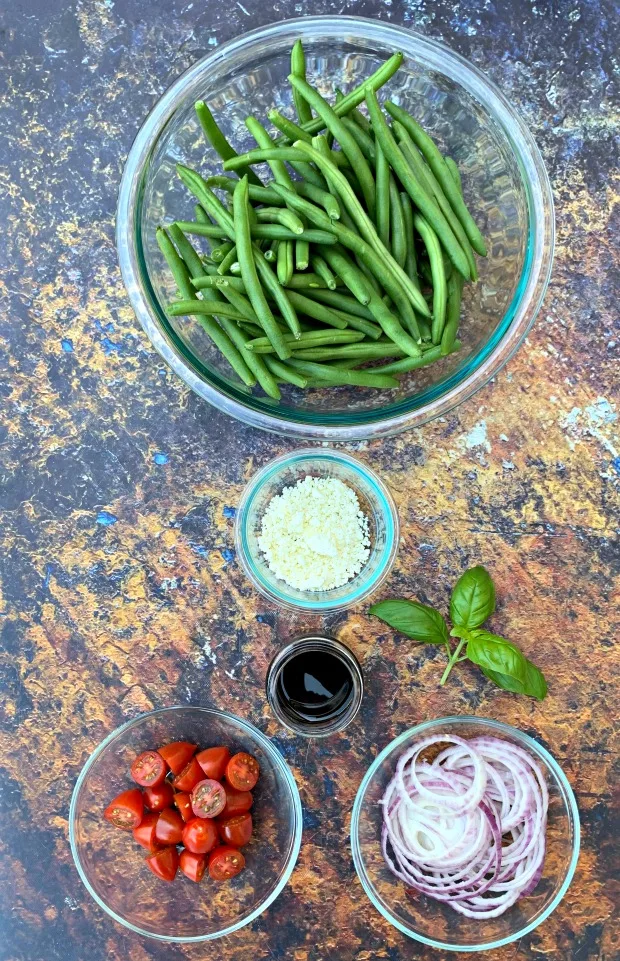 ingredients for cold green bean salad with tomatoes and feta cheese